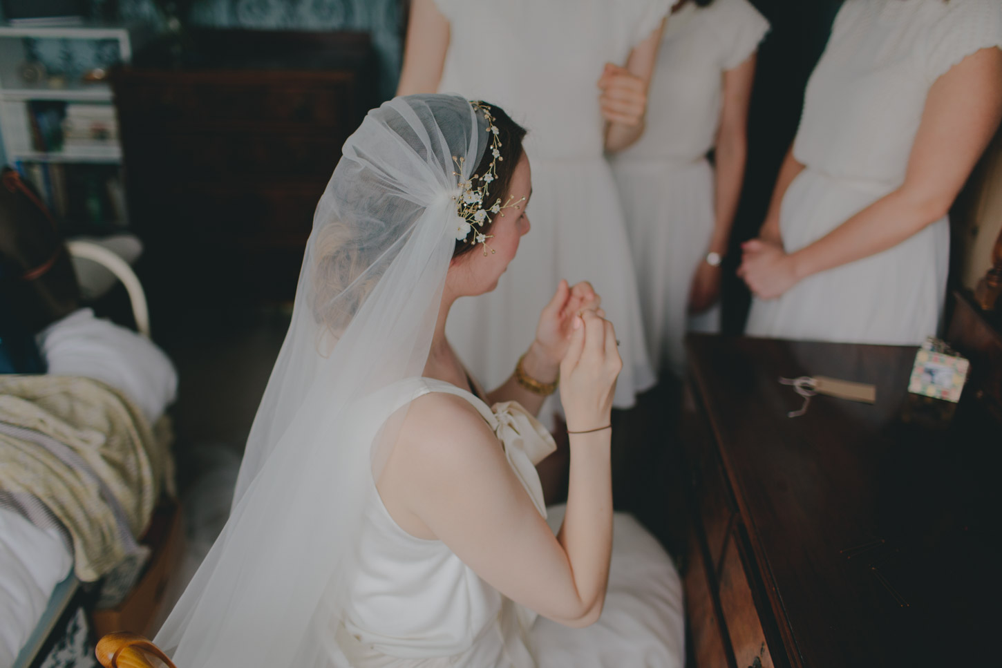 Bride getting ready at dressing table 