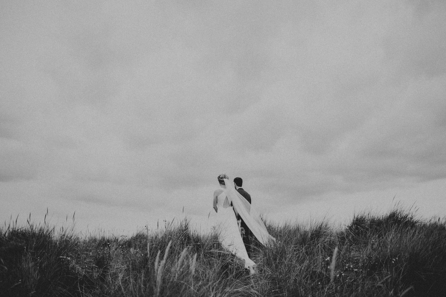 Bride and groom on norfolk dunes