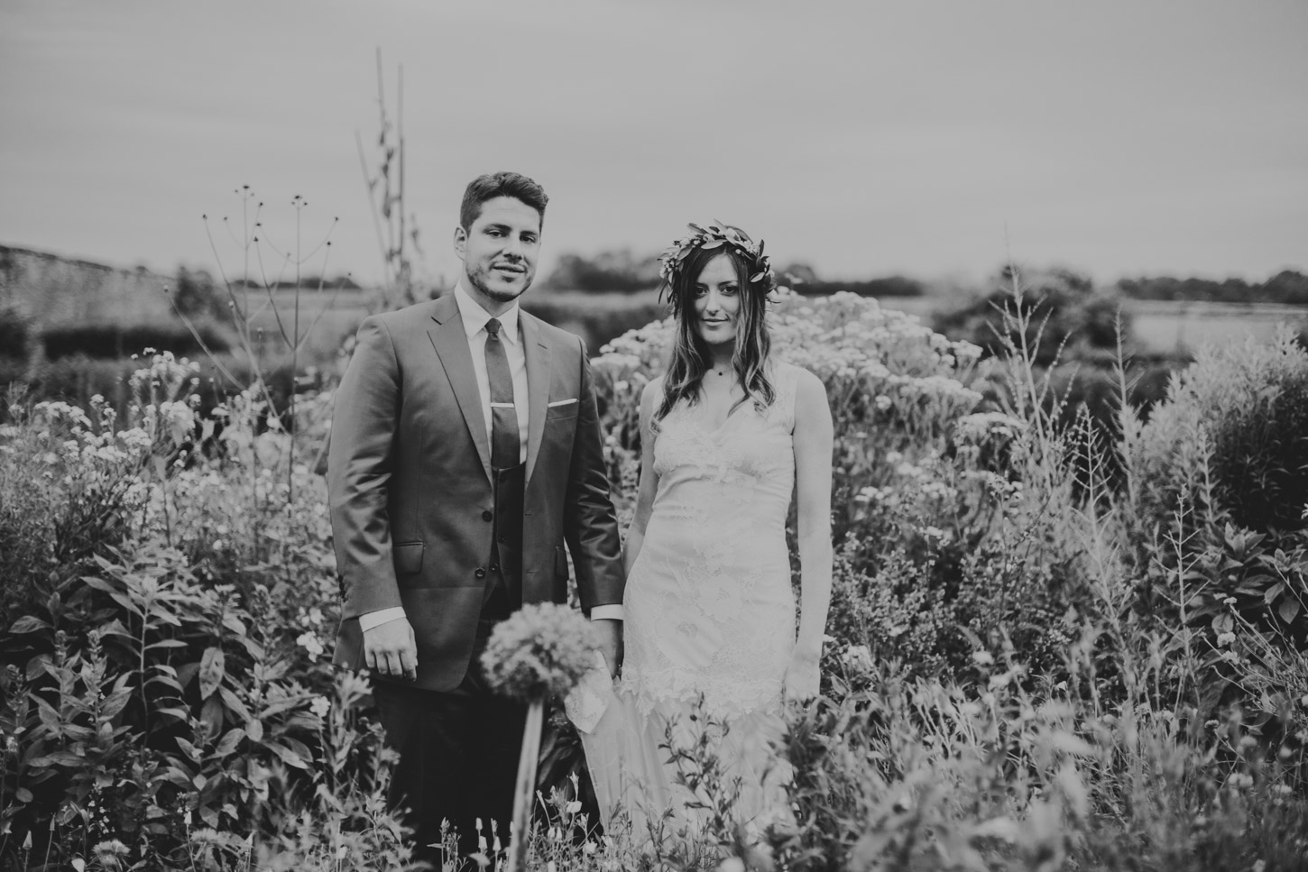 black and white image of bride and groom in garden