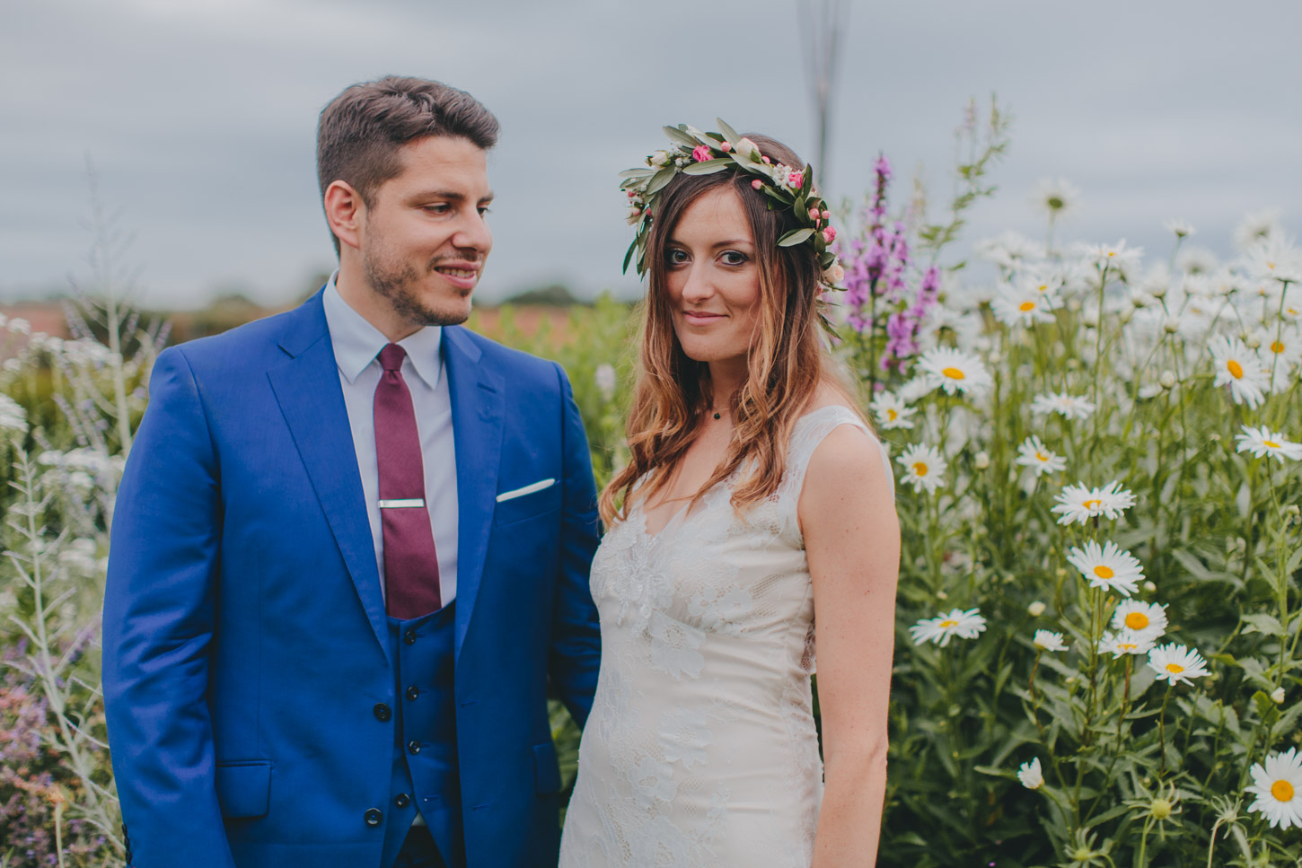 bride and groom in english flower garden